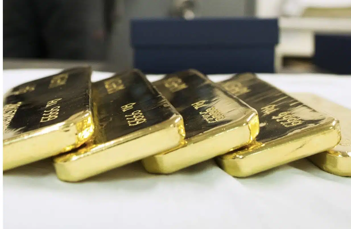 Newly-cast bullion gold bars sit in safe room