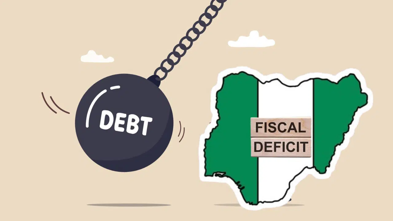 A “debt” wrecking ball swinging towards the Nigerian flag framed in the country’s shape