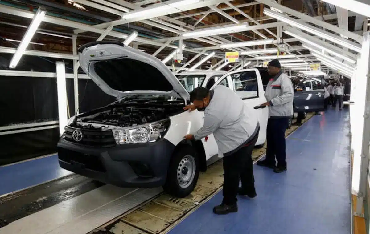 Workers check a vehicle coming off the production line at Toyota’s South Africa Motors plant in Durban, South Africa