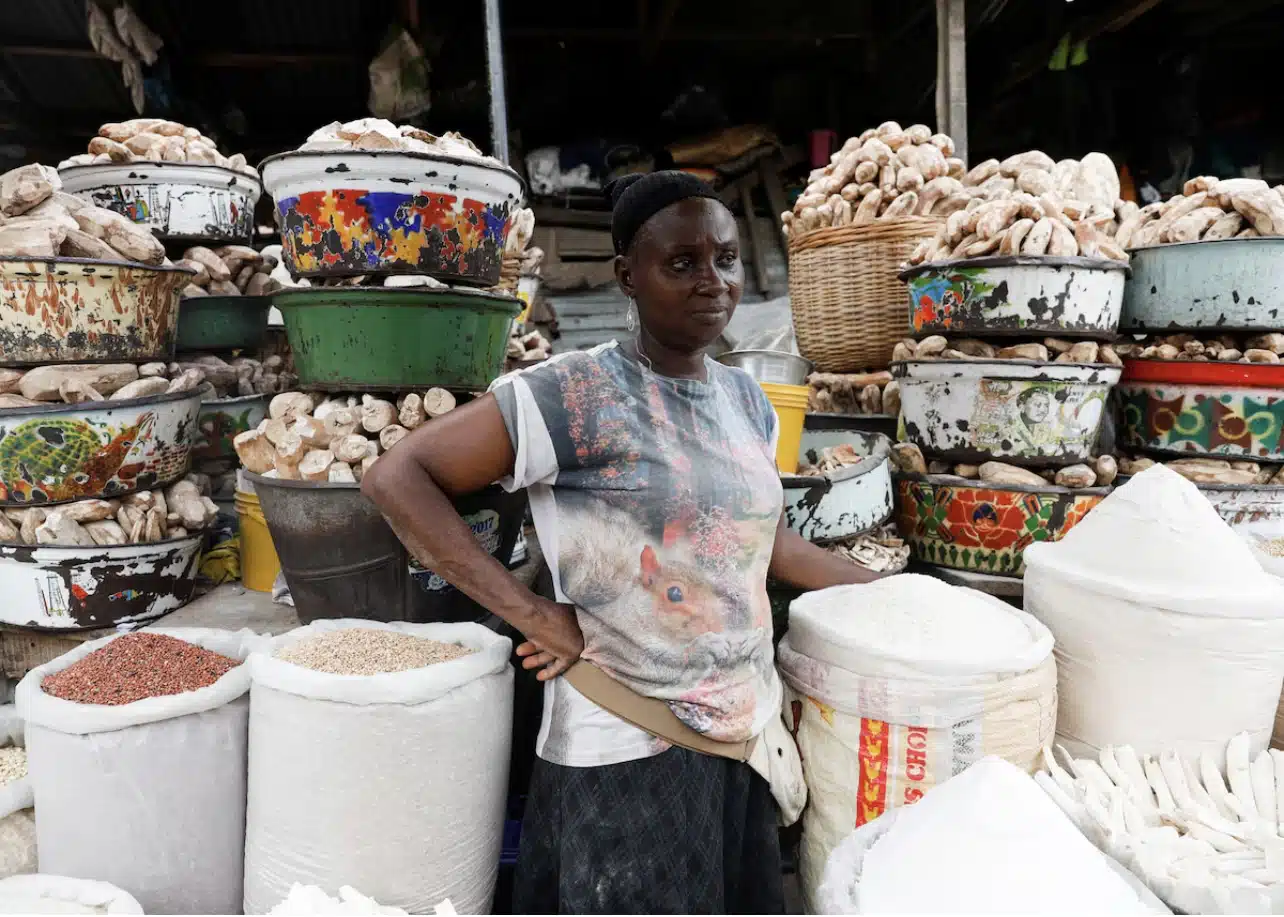 A vendor looks on as she awaits customers at her stall in Mile 12 International Market in Lagos, Nigeria
