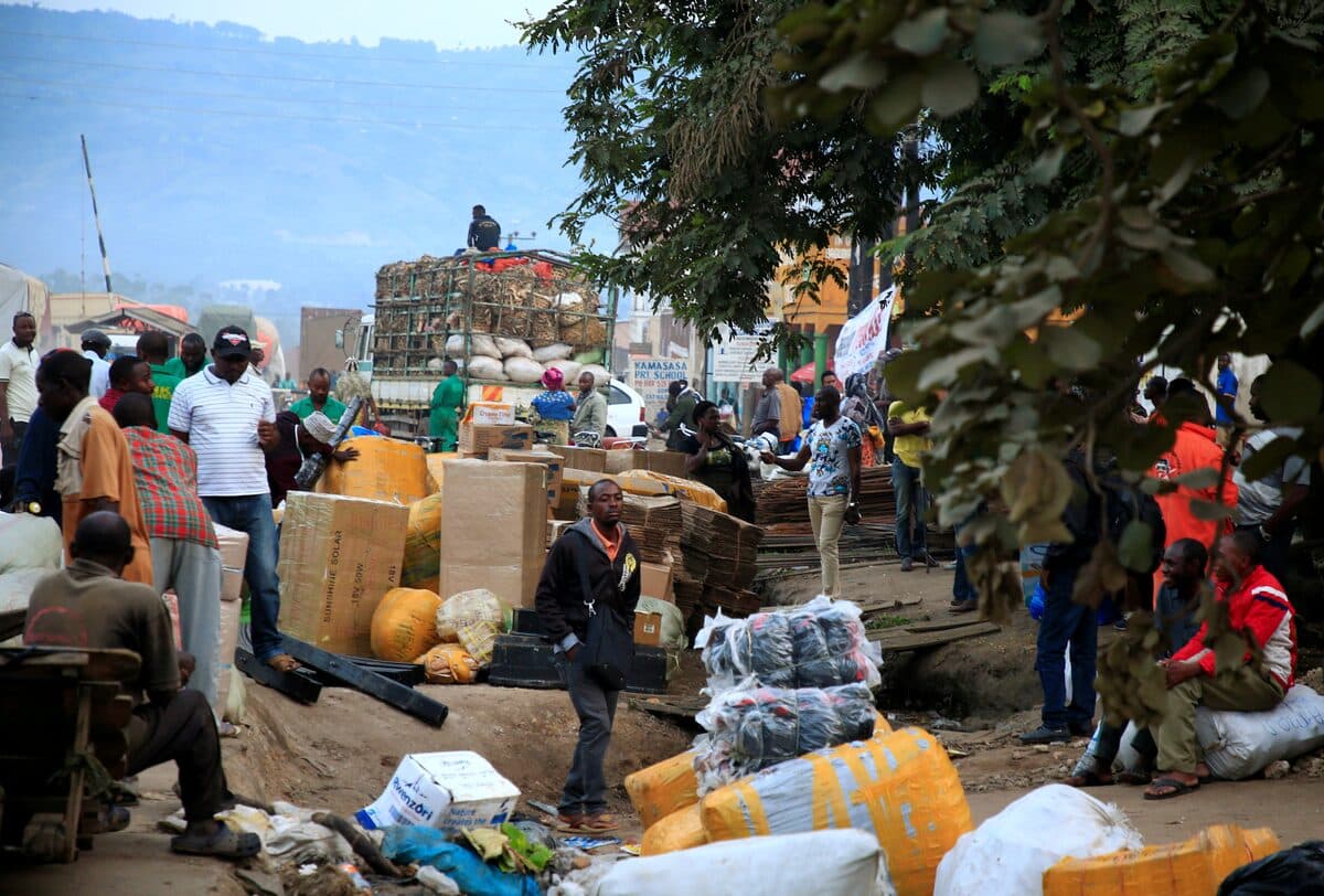 Ugandan business people are seen at a market with their merchandises for sale at Mpondwe border that separates Uganda and the Democratic Republic of Congo, in Mpondwe, Uganda