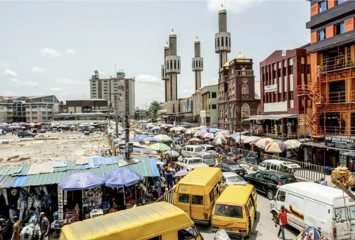 Busses, shops and a mosque in Lagos, Nigeria